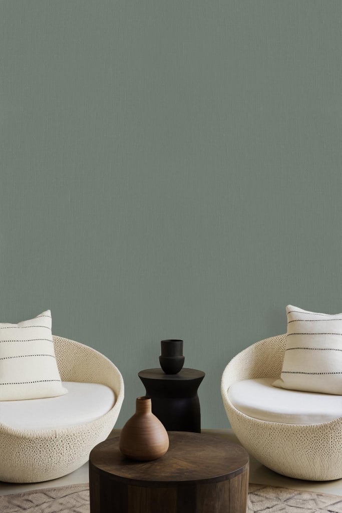 Muted jade green wallpaper, calming atmosphere.