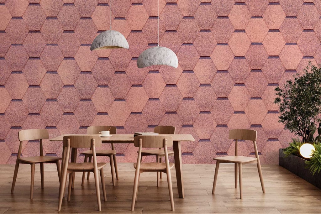 The wallpaper in the modern dining area features a hexagonal pattern with varying shades of pink, ranging from soft blush to deeper rose tones. The geometric design creates a contemporary feel and adds depth and interest to the room.