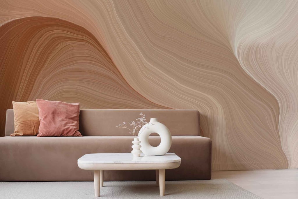 The wallpaper is a beige textured background featuring flowing, wavy patterns. It highlights elements of meticulous fabrication with its intricate design and soft neutral colors, perfect for a minimalist aesthetic.
