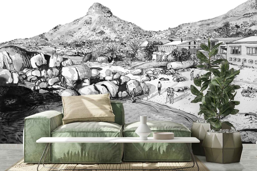 The black and white mural features a dramatic rocky landscape with a mountainous backdrop and a few distant buildings.