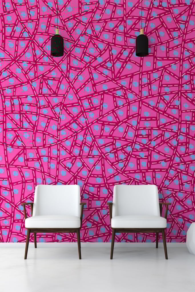 Bold abstract pink wall, blue dots, intersecting lines, geometric pattern.