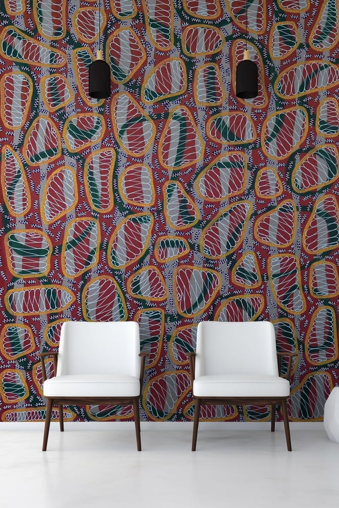 Abstract patterned wallpaper with red, green, yellow, and white shapes.