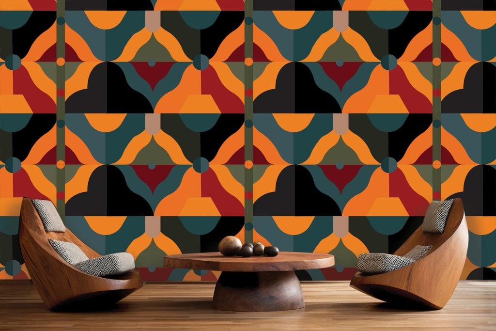 The wallpaper features a Litema-inspired geometric mural with bold shades of orange, teal, red, and black.