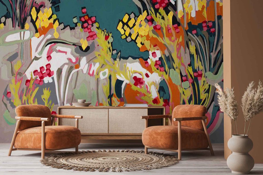A bold, colorful Abstract Erica mural wallpaper features vivid floral and animal-like shapes in a dynamic pattern, showcasing rich hues of blue, orange, yellow, pink, and green—making it a striking focal point for modern interiors.