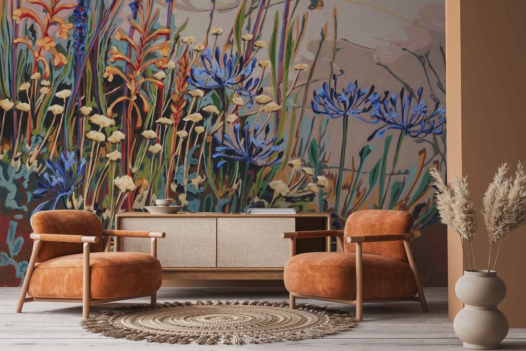 Large mural wallpaper featuring wildflowers, prominently Watsonia and Agapanthus, with vibrant colors—pinks, purples, whites, and greens—creating a lively botanical scene.