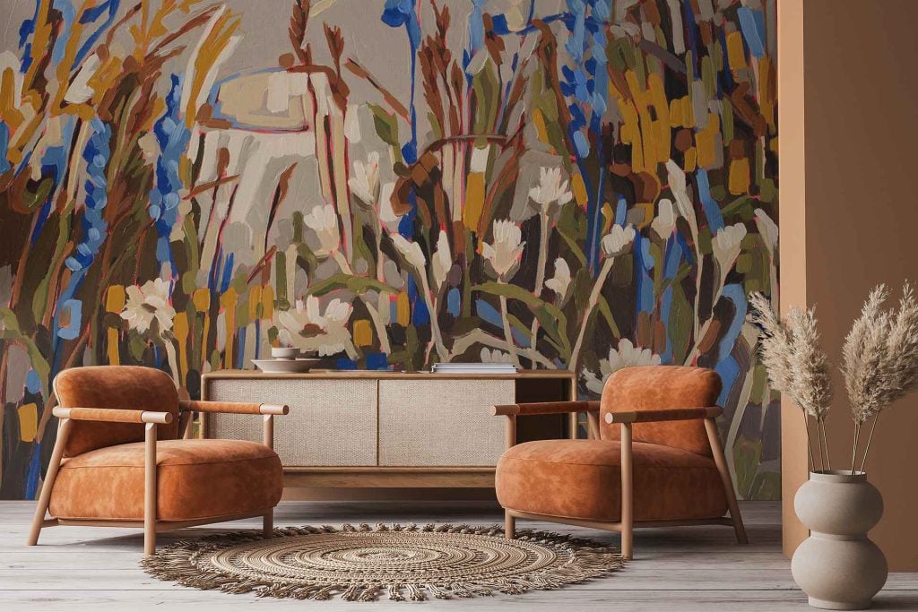 Large Aristea floral mural from the Amplify series featuring bold blue, yellow, and white flowers. The design includes oversized petals, expressive brushstrokes, and a vivid botanical motif that stands out against a light background. Colors present: deep cobalt blue, mustard yellow, crisp white, hints of green foliage.