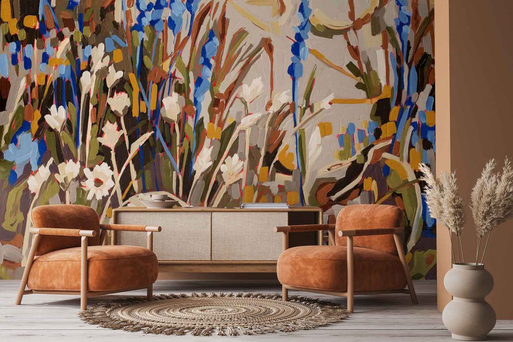 The vibrant Aristea floral mural from the Amplify series features bold, colorful floral patterns with lively hues and intricate botanical elements, creating a striking wallpaper backdrop for the space.