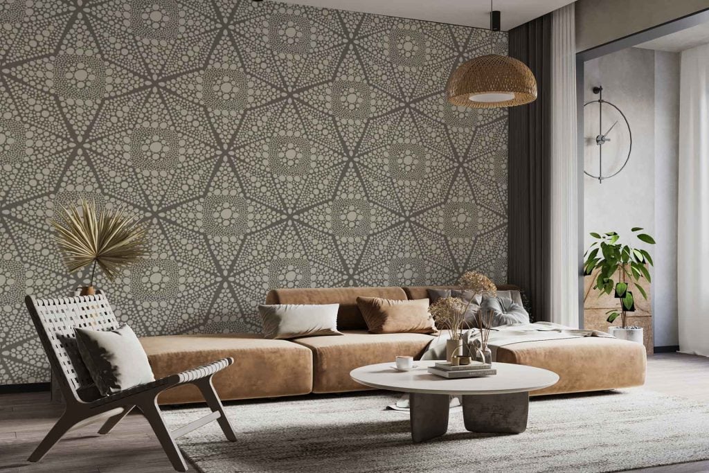 Patterned feature wall wallpaper showcases a mix of organic, tortoise shell-inspired motifs in warm earth tones—caramel, tan, chestnut, and cream—with subtle geometric overlays. The design includes delicate natural accents like leafy silhouettes and abstract speckles. Soft gold and muted green highlights complement the overall organic look, adding depth and a sense of movement to the wallpaper.