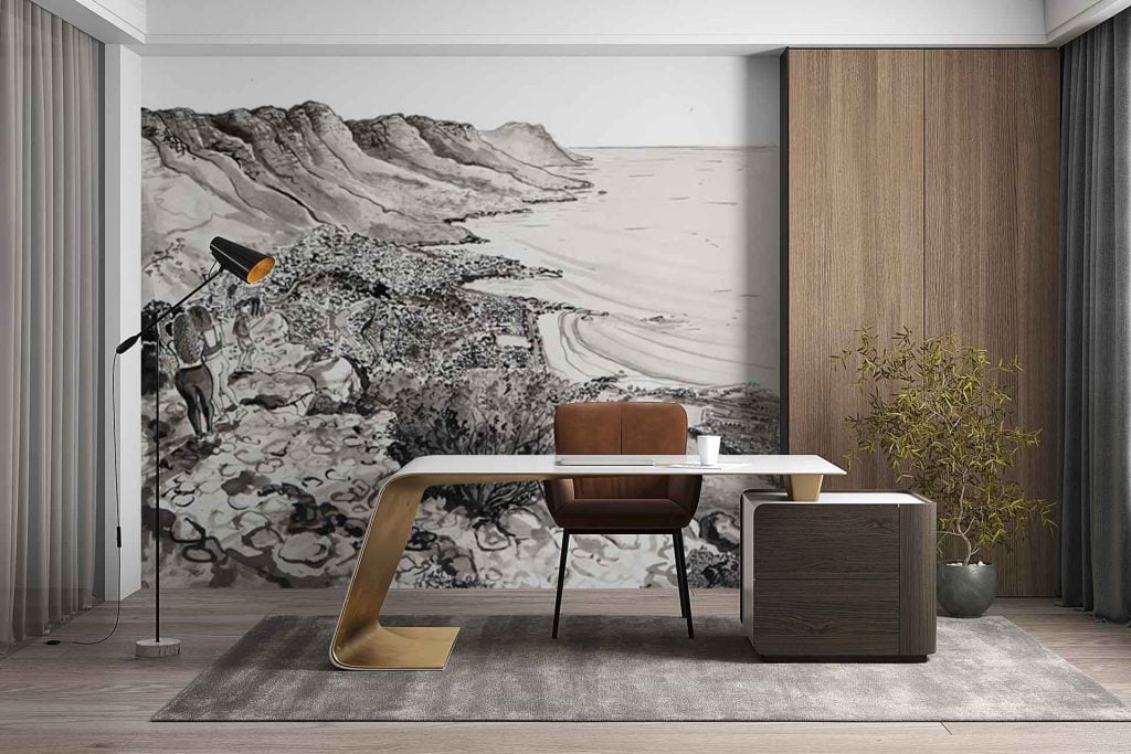 Wall mural wallpaper: Features a detailed rocky coastline with dramatic cliffs, serene blue water, and distant mountains in muted grey-blues. Central to the scene is a solitary figure standing near an old stone facade perched on the cliff’s edge. Earthy tones—warm browns, cool greys, deep green foliage—blend with soft sky gradients for a tranquil yet majestic landscape.