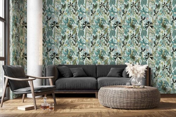 The wallpaper features a bold botanical pattern with large green leaves and blue floral elements. Shades include emerald, forest green, teal, navy and cobalt blue. Leaf motifs intertwine with stylized flowers and vines against a contrasting base for visual impact.