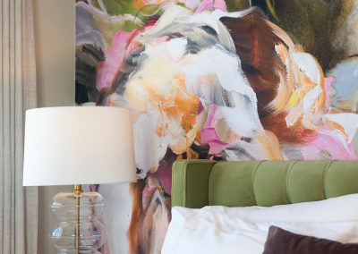 Colorful abstract floral mural wallpaper featuring bold brushstrokes in vibrant shades of teal, coral, mustard yellow, deep blue, and soft blush pink. The design includes oversized flower shapes with expressive outlines and scattered leaves, creating a modern botanical look with dynamic color contrasts and painterly texture.