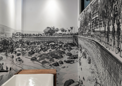 Black-and-white wallpaper mural featuring a detailed cityscape merging with a rugged rocky shoreline; architectural elements, skyscrapers, bridges, textured rocks, grayscale tones throughout with sharp contrasts and intricate urban and natural details.