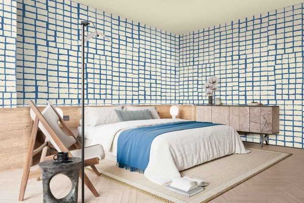 Bold blue and white wallpaper with a grid pattern; intersecting blue lines on a crisp white background; geometric, modern, graphic design; striking contrast between cobalt blue and bright white.