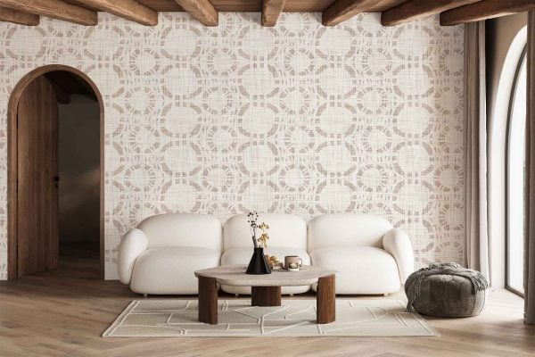 The wallpaper features a modern geometric design with interlocking shapes in muted tones of beige, cream, and soft gray. Its pattern includes angular lines and repeating diamond motifs, creating visual interest while maintaining a warm, inviting atmosphere.