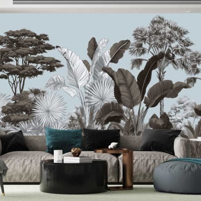 The wallpaper features a mural of tropical trees and oversized leaves in muted tones such as soft greens, pale blues, gentle greys, and subtle taupes. Artistic elements include detailed palm fronds, banana leaves, and layered foliage creating depth. The overall effect is a dreamy botanical landscape with an 