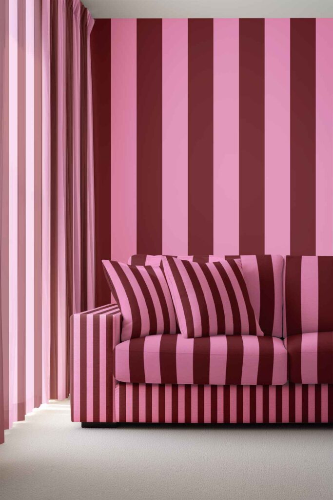 Vertically striped wallpaper in pink and burgundy, featuring bold alternating lines that create a modern, stylish look.