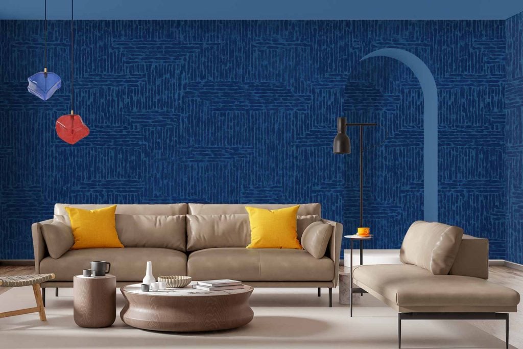 Blue textured wallpaper with a curved doorway; features a distinct deep blue hue and tactile pattern, making the wall stand out in the room.