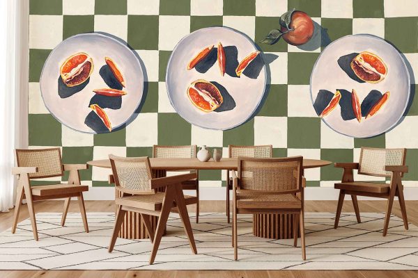 Checkerboard wallpaper with bold alternating squares and large painted figs plus a single peach on decorative plates; colors include rich purple, green, peach, and black.