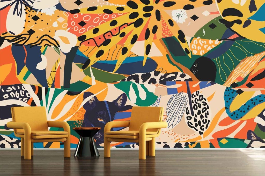 Vibrant abstract wallpaper featuring bold shapes and patterns in orange, green, yellow, black, white, and blue.