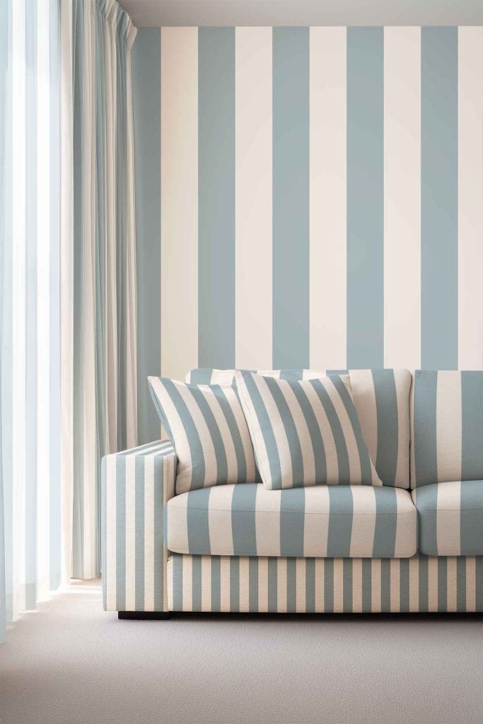 Blue Stripe wallpaper with vertical blue and white stripes, creating a bold linear pattern on the wall.