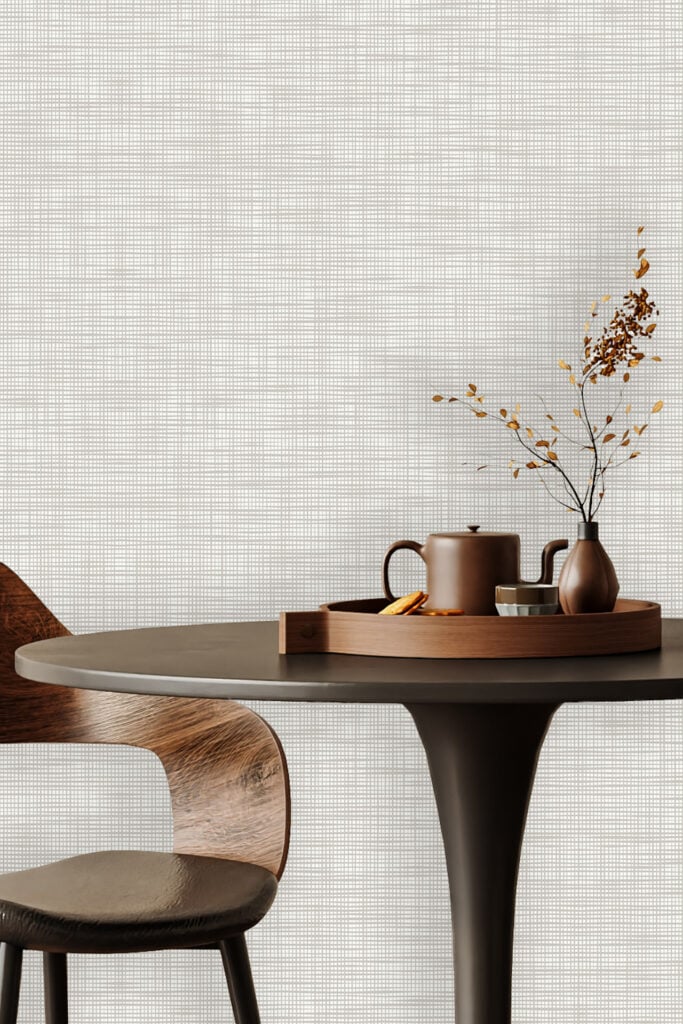 Light-colored wallpaper with a subtle grid pattern and textured surface, featuring soft, neutral tones that add a modern touch to the room.