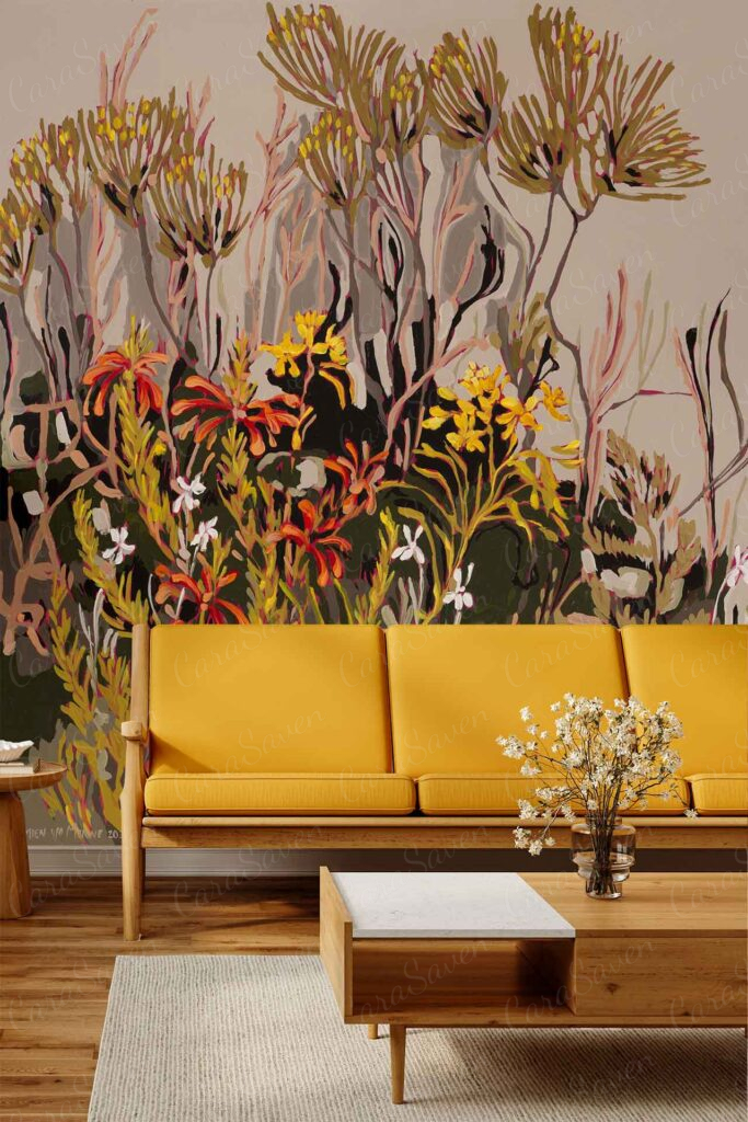 Colorful abstract wall mural with wildflowers and foliage in vibrant shades of yellow, green, pink, blue, and orange. The wallpaper features various leaf shapes and flower patterns for a lively botanical look.