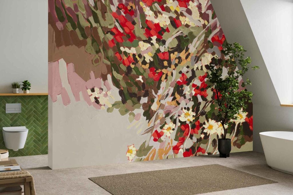 Colorful abstract floral mural featuring bold shapes and vibrant hues such as pink, blue, yellow, and green. The design includes oversized flower patterns and sweeping brushstrokes against a light background.