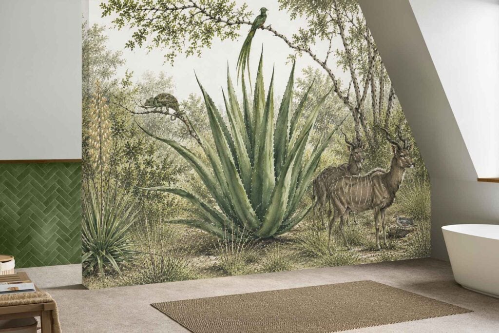Mural wallpaper features large green agave plants, two antelope, birds, and dense summit trees. Colors include vibrant greens and earthy tones.
