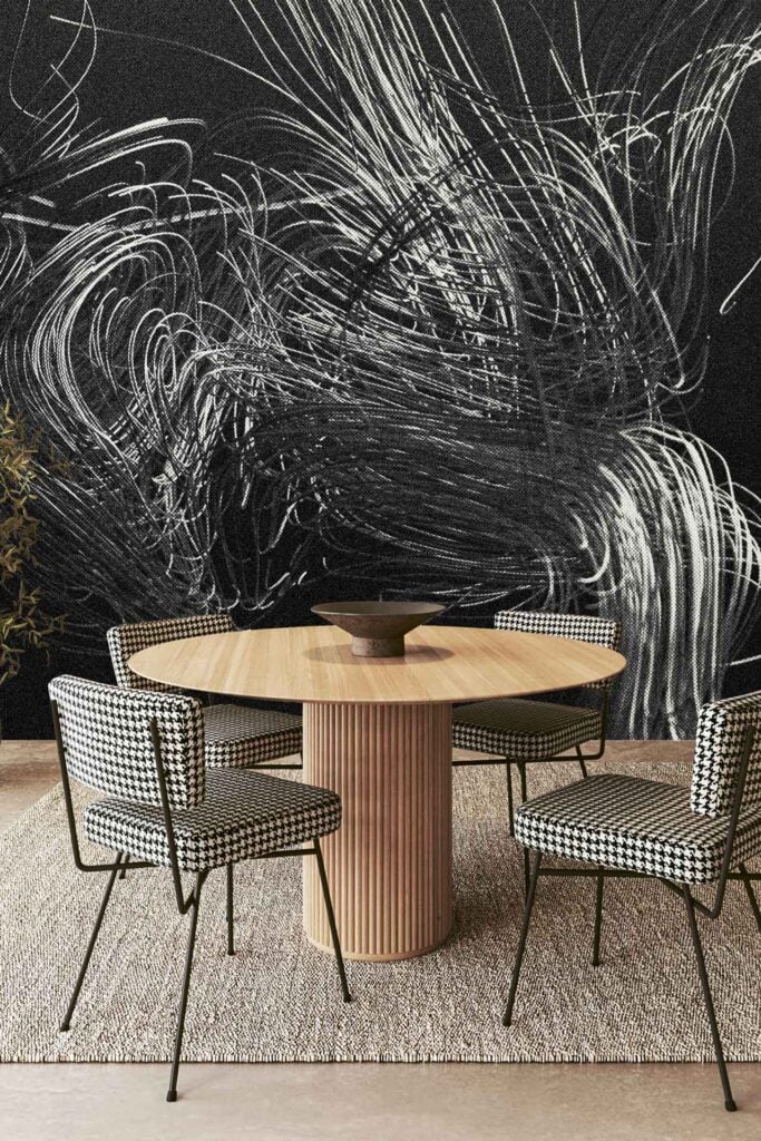 Bold black wallpaper with striking white abstract swirl patterns.