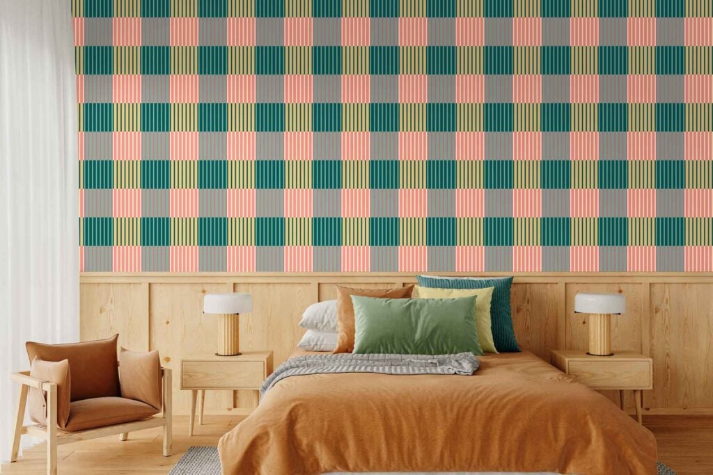 Colorful checkered wallpaper in teal, pink, yellow, and gray blocks decorates the wall behind the bed.
