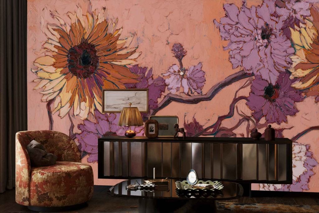 Floral mural wallpaper with prominent yellow and pink flowers on a pink and peach-toned background, creating a vibrant botanical pattern.