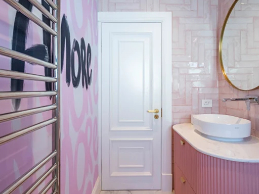 Pink wallpaper features graffiti-style black text as its main decorative element, creating a bold and artistic look.