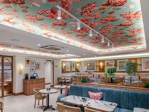 Wallpaper features vibrant coral and teal patterns resembling coral reefs, creating an ocean-themed atmosphere with bold, aquatic-inspired colors.