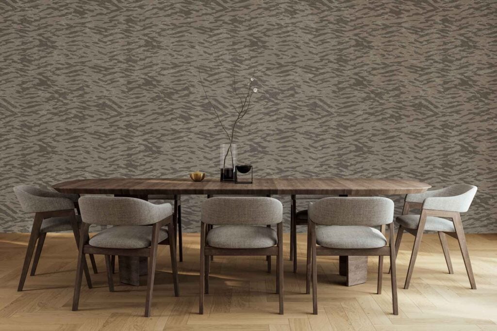 A patterned gray accent wall features subtle geometric designs in varying shades of gray, adding texture and modern style to the dining room.