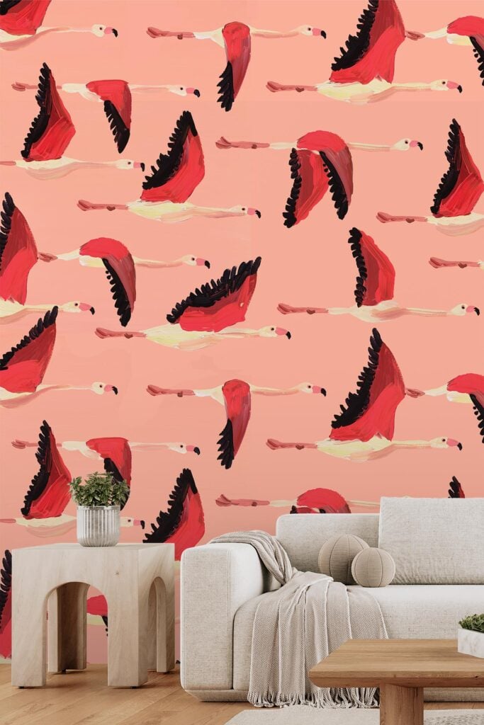 Bold wallpaper features illustrated flamingos in flight with vibrant pink feathers against a soft pink background, creating a playful, tropical vibe.
