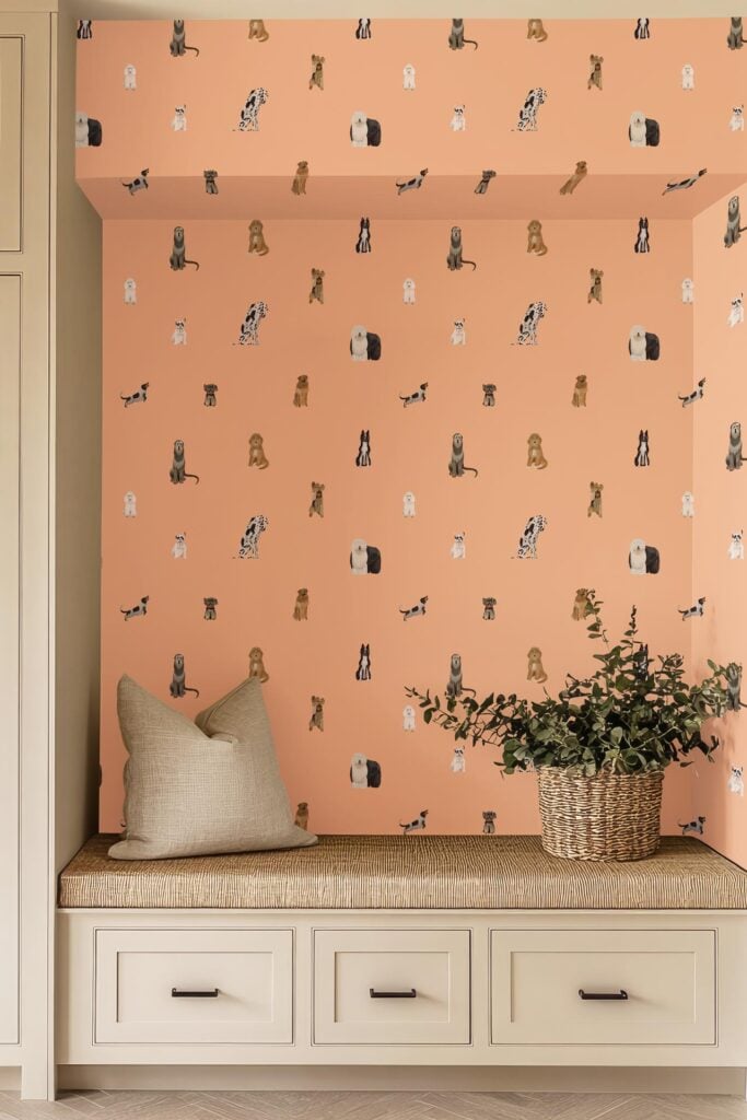Peach-colored wallpaper with playful illustrations of various dog breeds, including a Goldendoodle, scattered among small neutral shapes in a whimsical pattern.