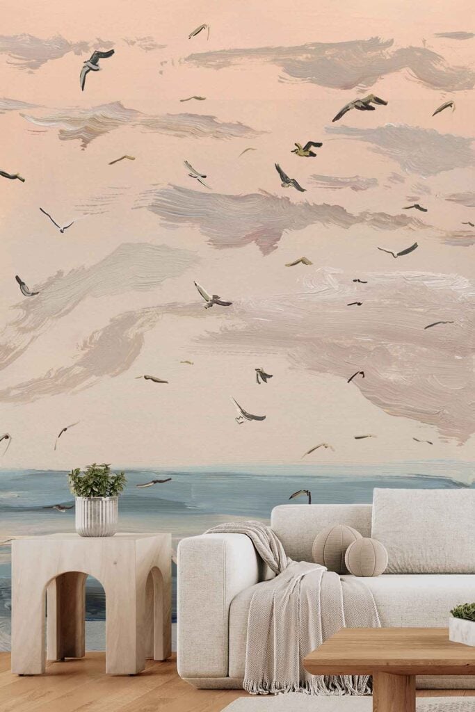 Wall mural featuring black Summer Palm silhouettes, a soft pastel sunset sky in hues of pink, purple, and orange over an ocean, with numerous birds flying across the scene.