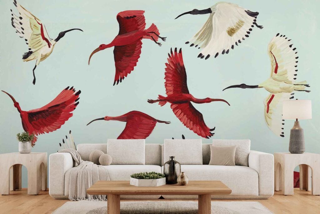 A mural wallpaper features six large flying birds, like Ibis Dancers, in striking shades of red, cream, and black. The birds' elegant wings and vibrant colors stand out as the wallpaper's focal elements.