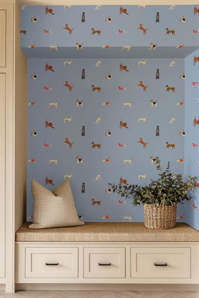 Blue wallpaper with playful dog patterns features multiple Vizsla silhouettes in motion. The design highlights beige and brown Vizsla dogs against a soft blue background, creating a lively, pet-themed decorative element.