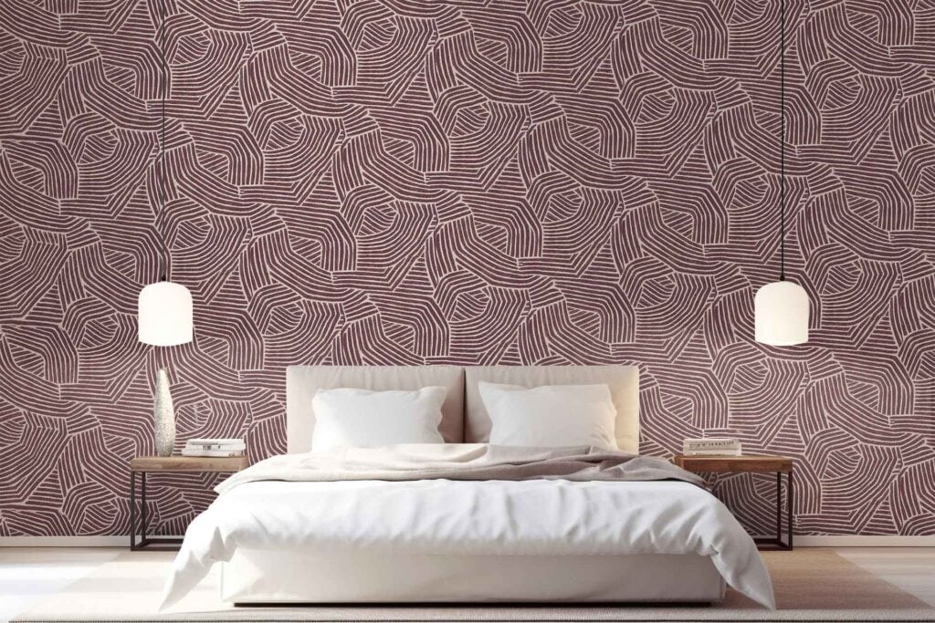 Geometric abstract leaf-patterned wallpaper in brown and beige tones, featuring distinct leaf motifs and angular shapes creating a cozy ambiance.