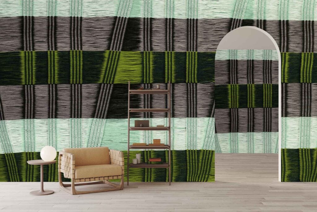Bold checkered wallpaper in black, green, and light blue tones dominates the room, featuring large geometric squares that create a striking modern accent.
