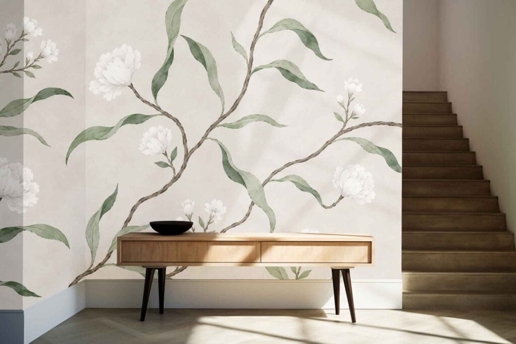 Large botanical wallpaper features lush green leaves and white flowers on a light background, creating a striking floral mural effect.