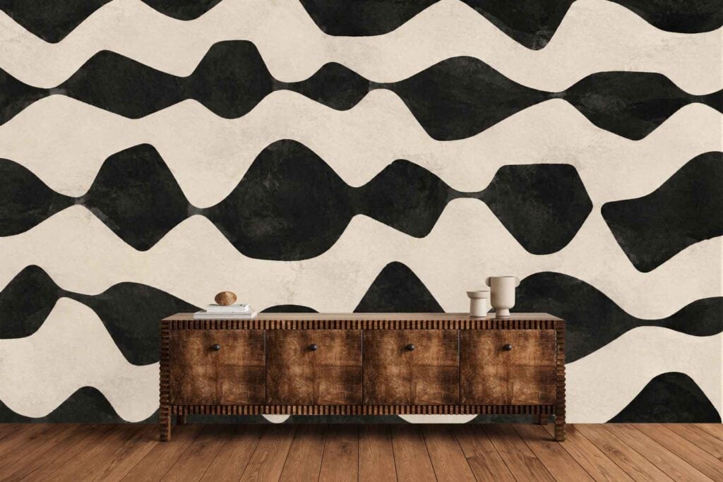 Abstract wallpaper with bold black and white wavy patterns; color scheme is exclusively high-contrast black and white, featuring undulating, organic lines.