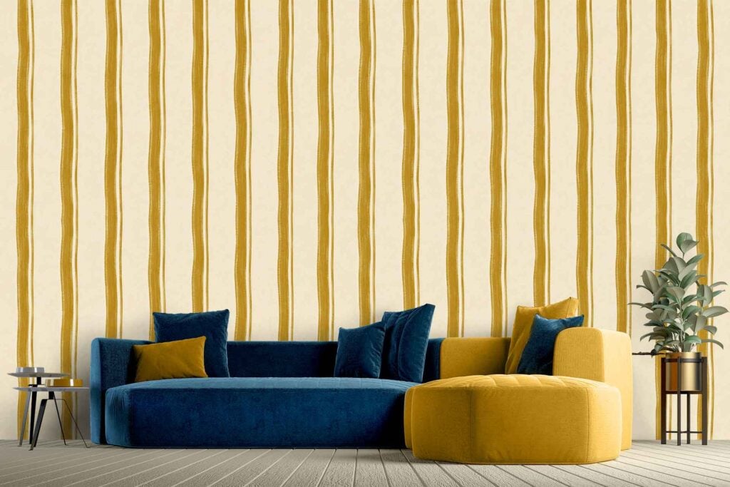 Feature wall with bold vertical yellow stripes set against a cream background, creating a vibrant and eye-catching wallpaper design.