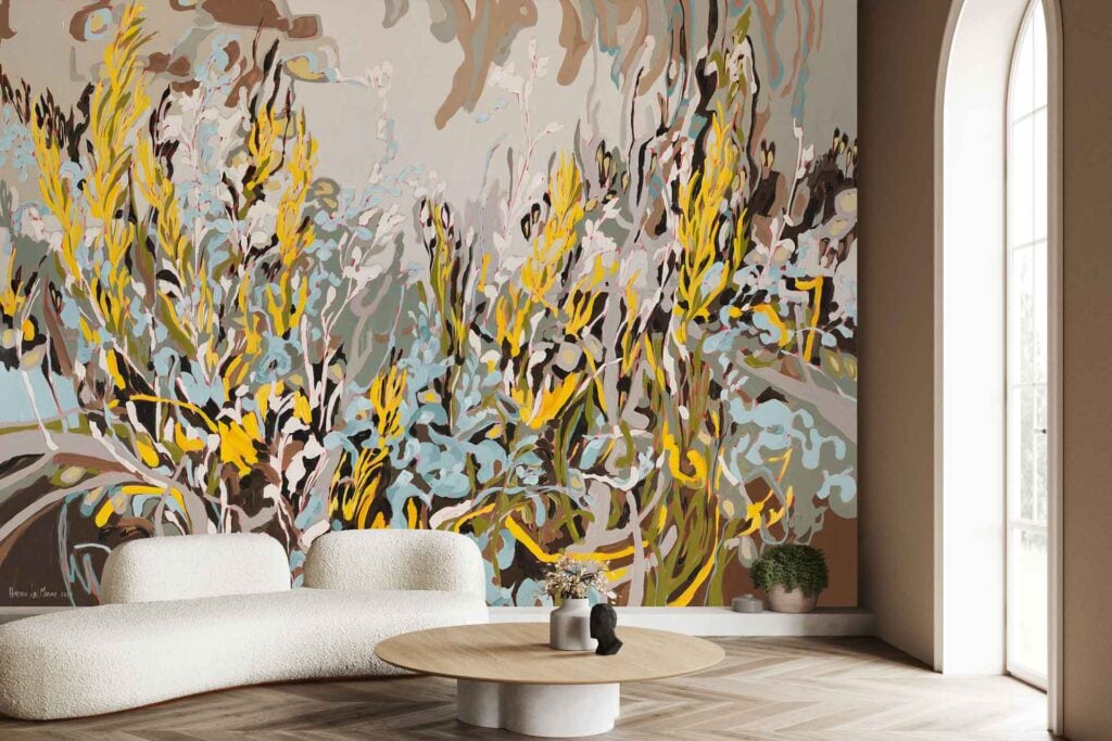 The wallpaper is a large abstract mural with bold yellow, blue, and beige floral patterns. The design features oversized flowers in those colors, creating a striking modern accent wall.