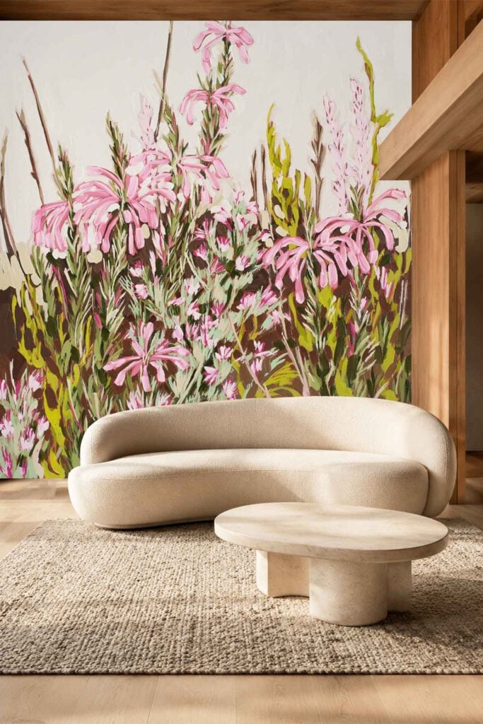The wallpaper is a large mural featuring vibrant pink and green flowers, creating an artistic and colorful floral backdrop ideal for highlighting botanical-themed or nature-inspired decor.