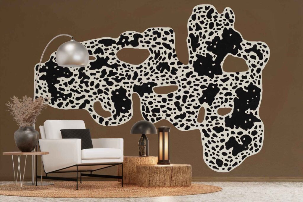 Cow-print abstract wall mural featuring bold black and white patterns, creating a striking, modern accent on the brown wall.