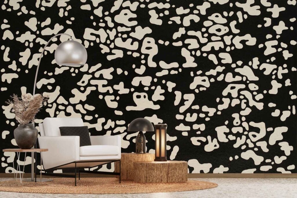 Bold black-and-white abstract patterned wallpaper, featuring striking contrasting shapes and dynamic geometric elements, creates an eye-catching modern backdrop.
