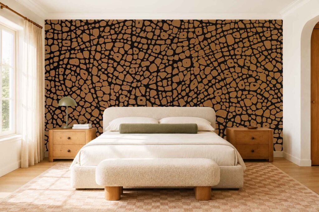The bedroom’s accent wall features bold abstract wallpaper with black and brown pebble-like shapes, creating a modern and artistic focal point.