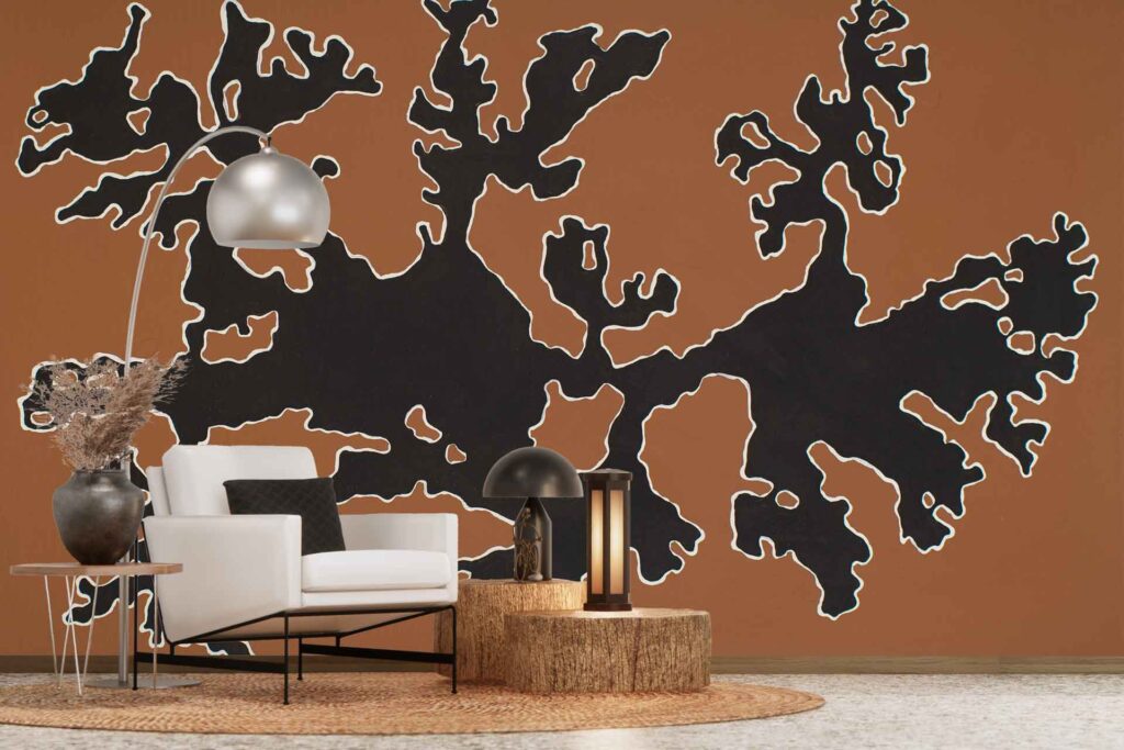 Abstract wallpaper featuring black and white organic shapes on a brown background. The pattern is bold and modern, highlighting flowing lines and contrasting colors: black, white, and brown.